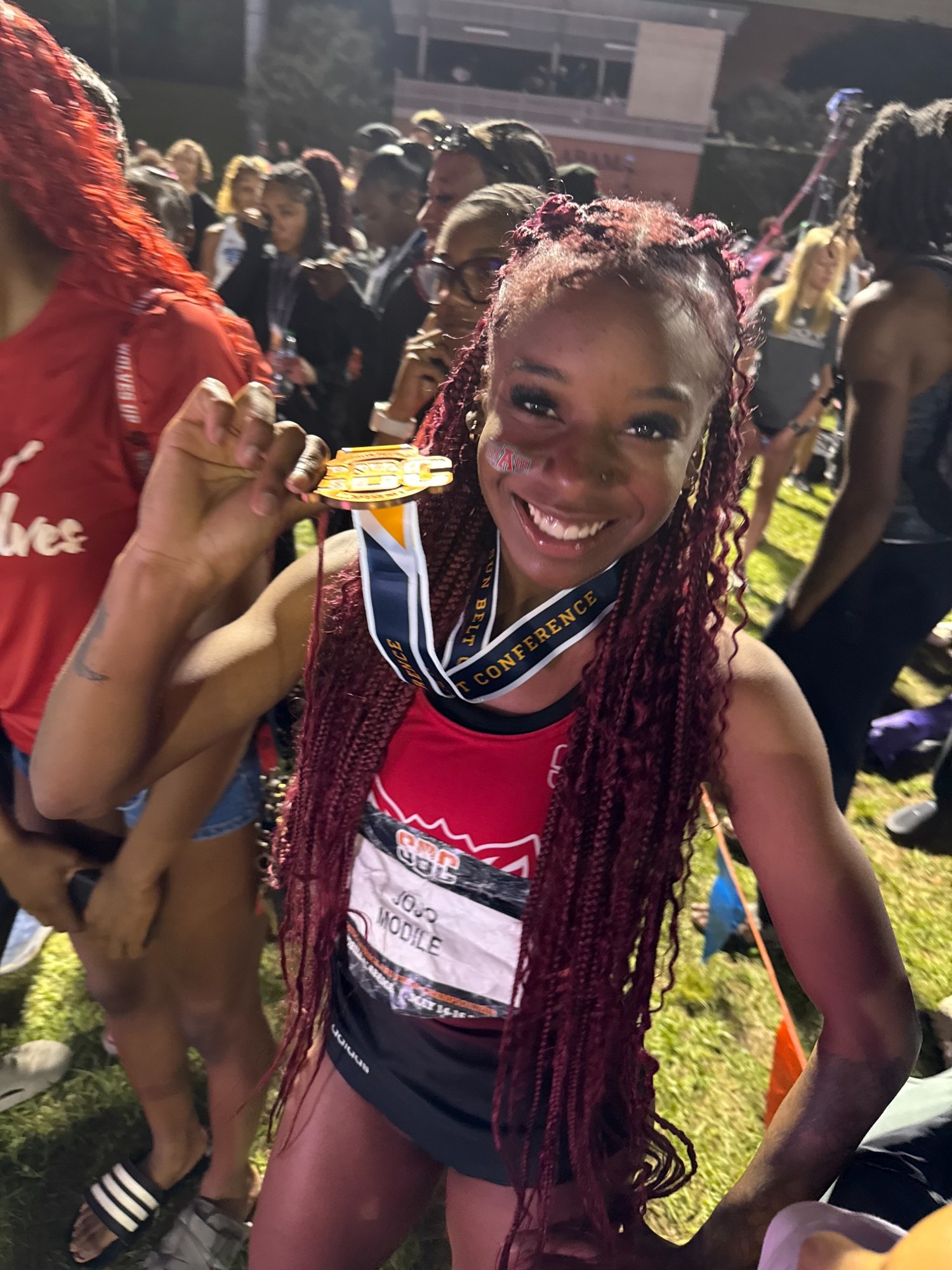 Jojo Modile smiling with her medal