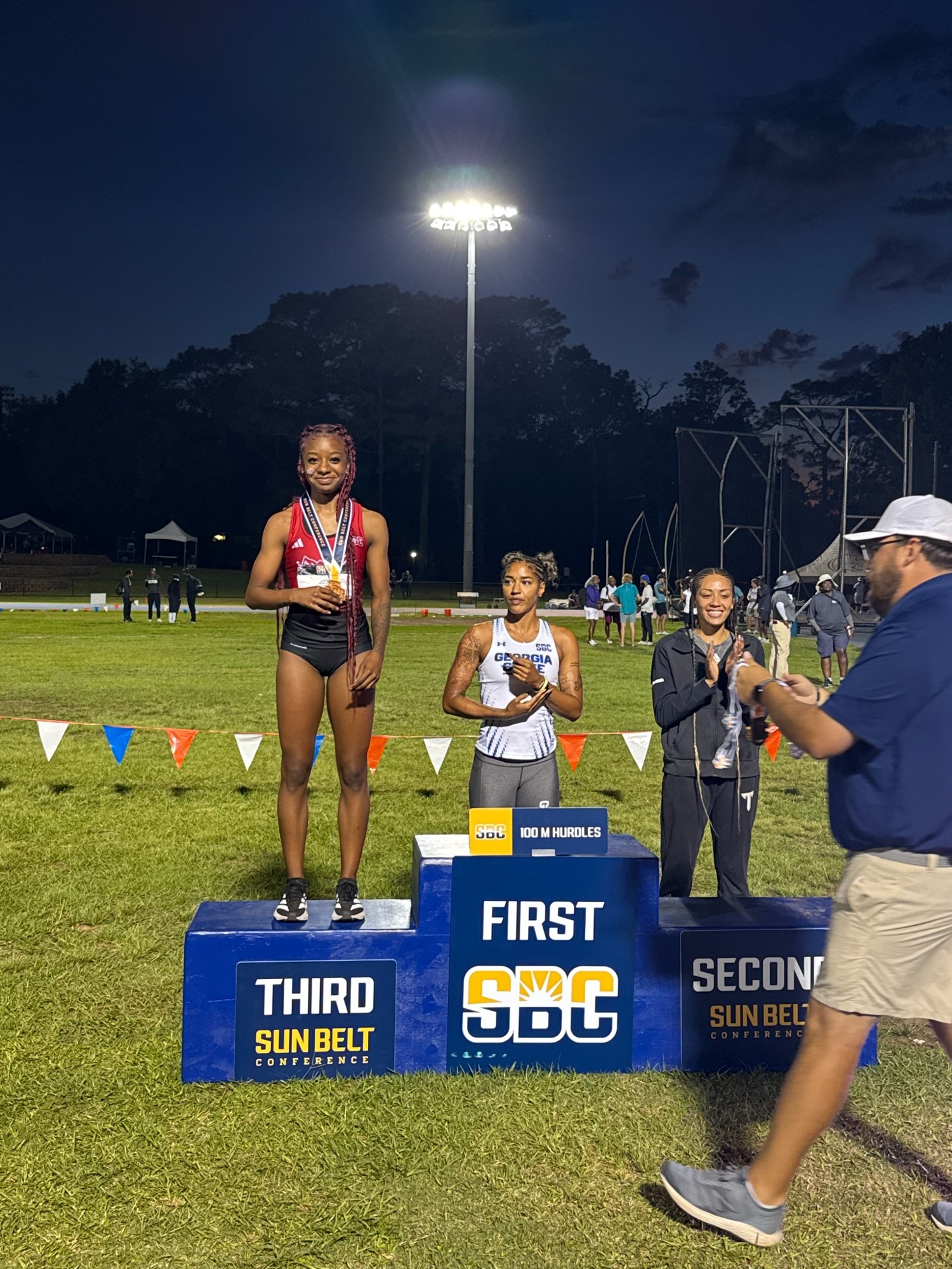 Jojo Modile on the Sun Belt podium